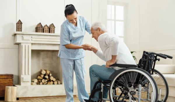 Caregiver supporting his patient.
