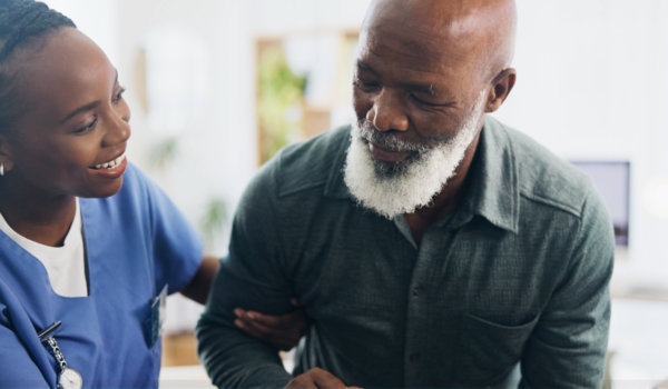 Caregiver attending to his patient.