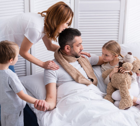 father embraces by his family