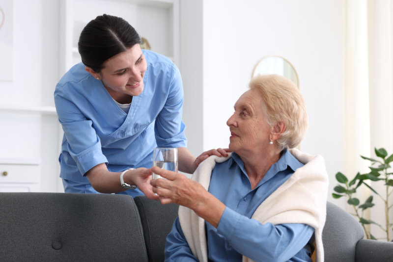 Caretaker caring for an elderly person